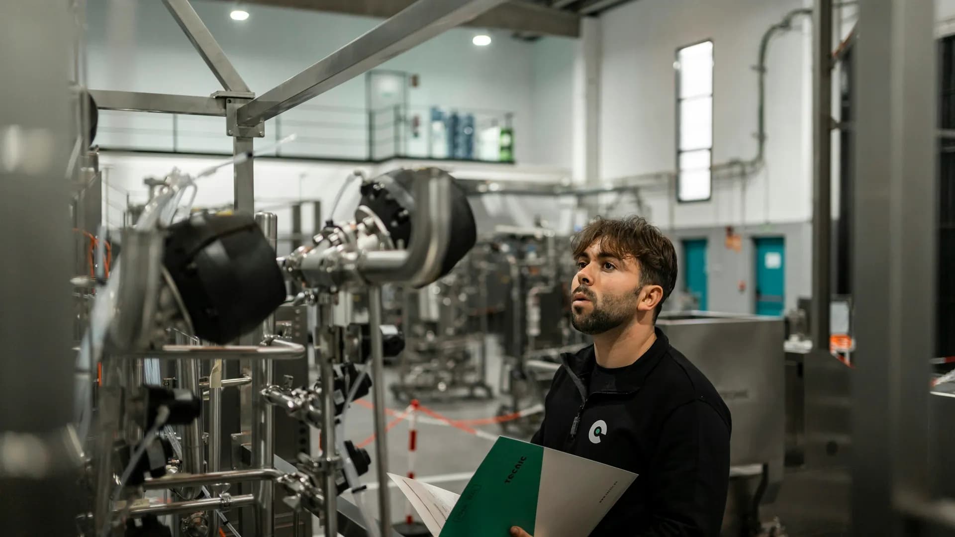 An engineer recording equipment details on a first service visit
